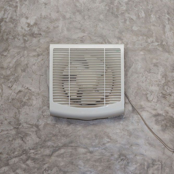 A White fan is Hanging on a Gray wall — The Latest Home Appliances in Rockhampton