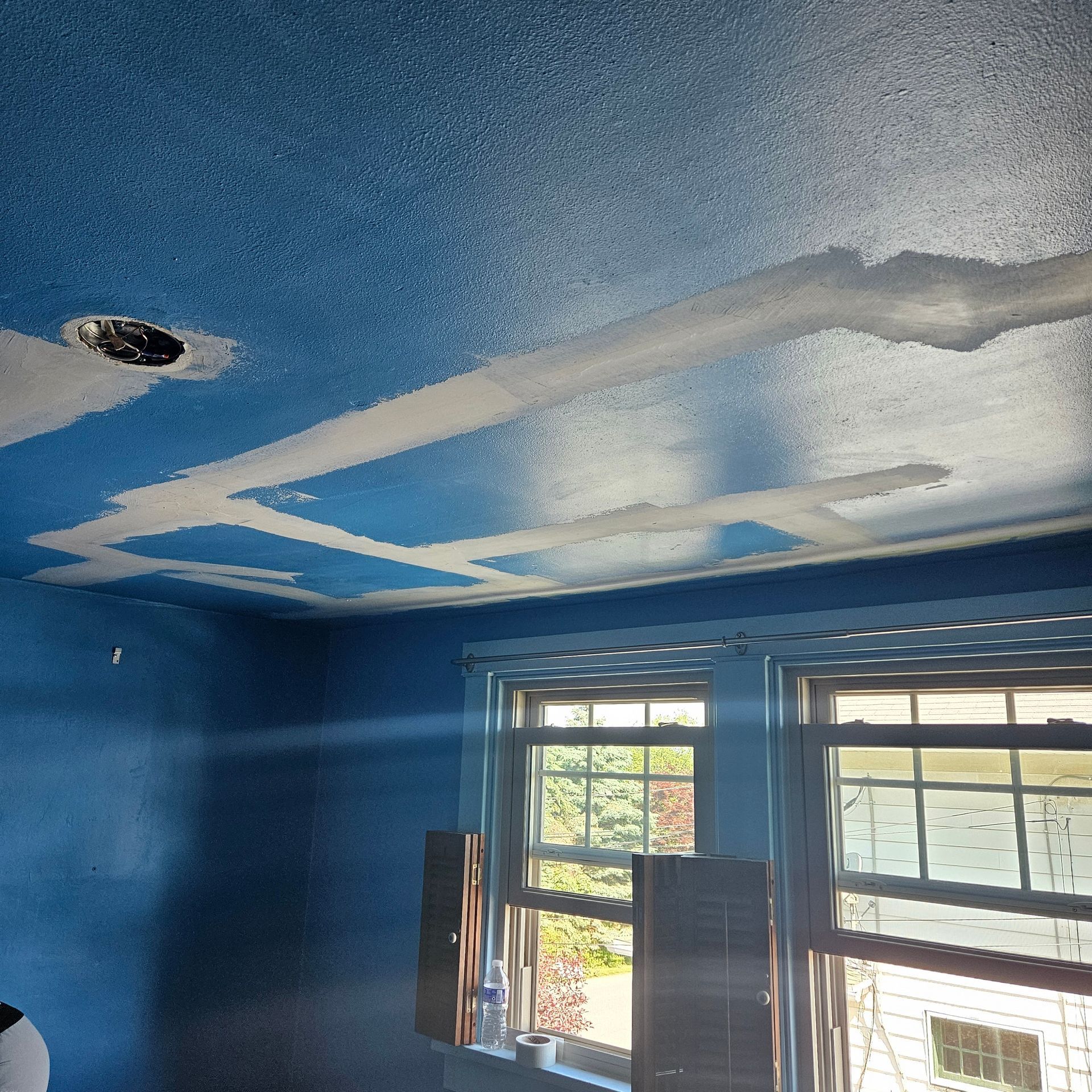 A wooden fence with a gate attached to it.