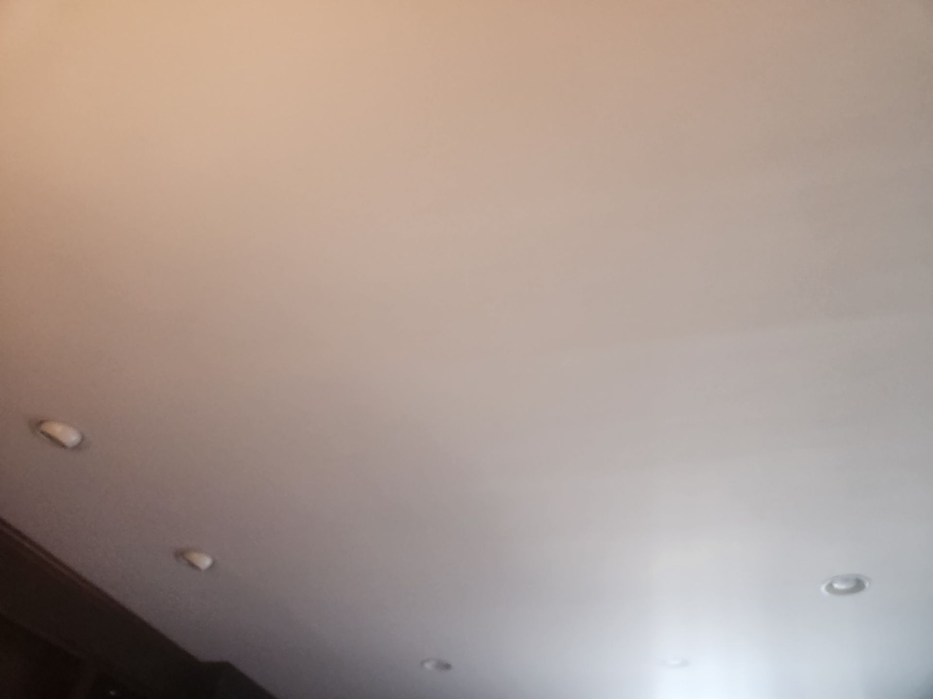 White ceiling with recessed lighting.