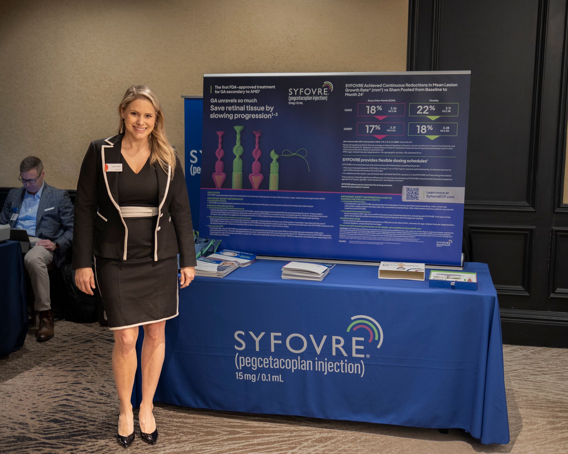 A woman is standing in front of a syfovre table