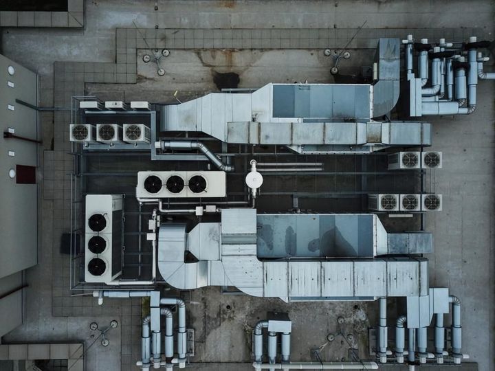 An aerial view of an air conditioning system on the roof of a building.