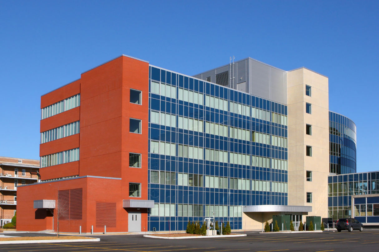 A large red brick building with a lot of windows