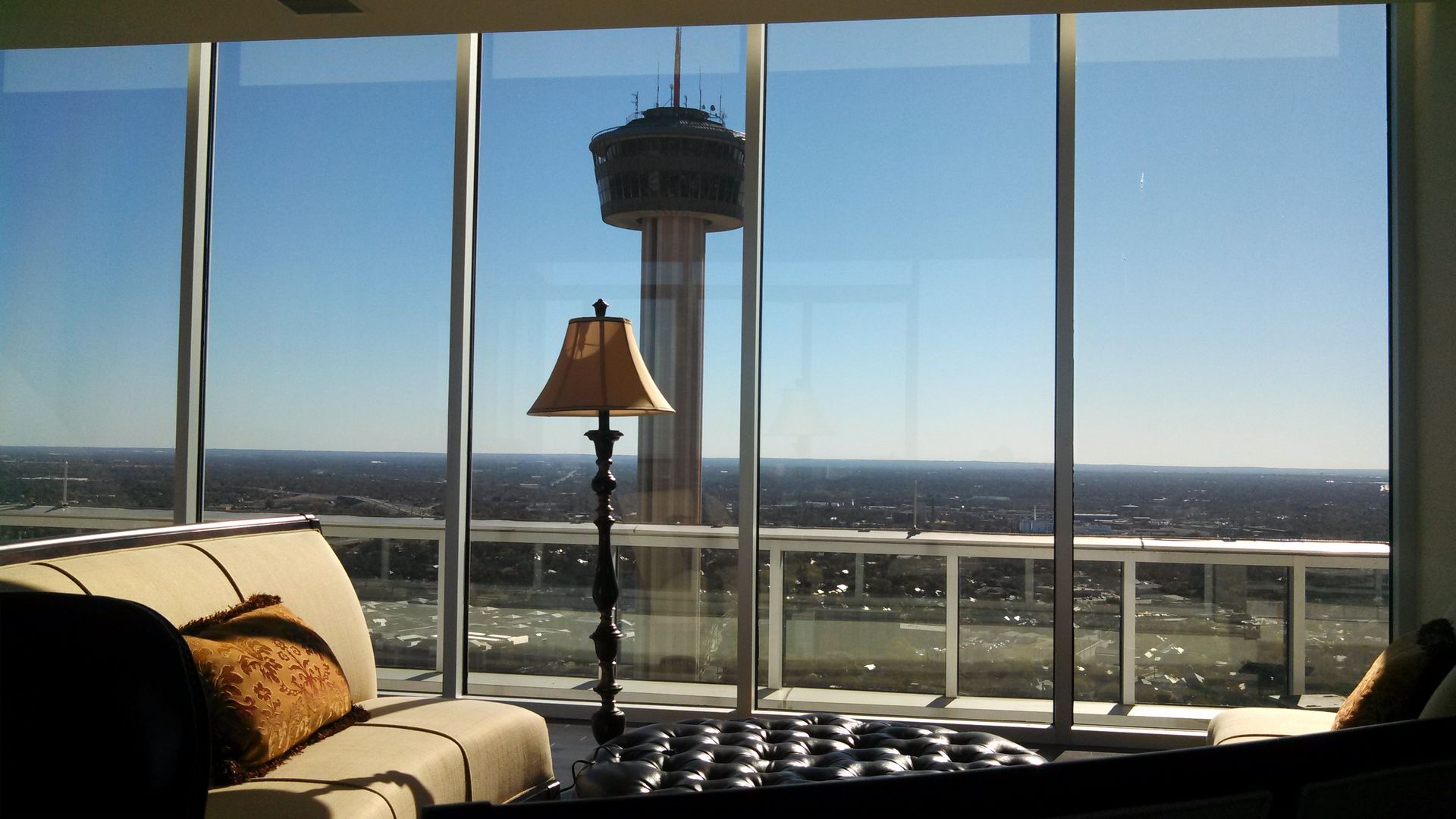 A living room with a view of a tower in the distance