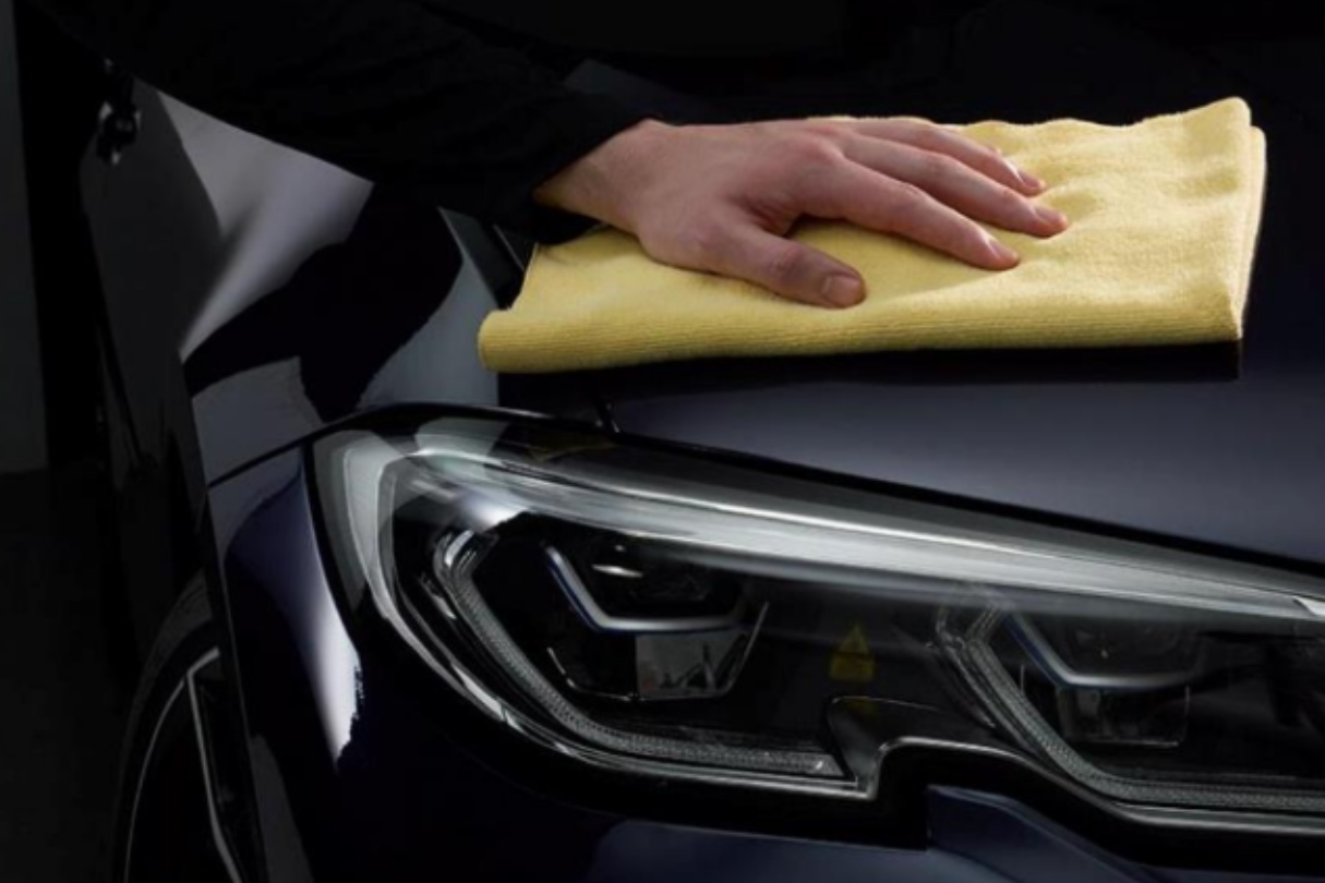 A black Tesla Model 3 driving down a highway with professional car ceramic coating in San Antonio.