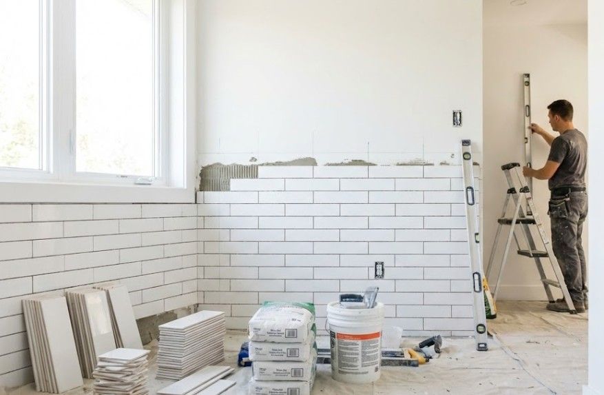 J & Z Property Maintenance tiling a property in Newport