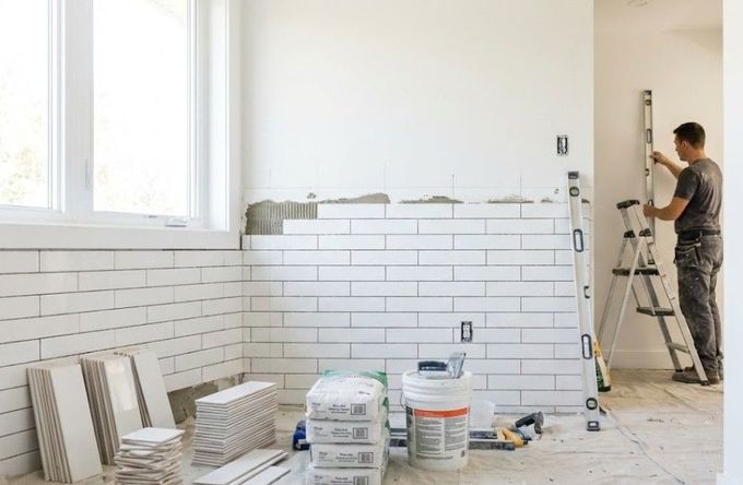 J & Z Property Maintenance tiling a property in Newport