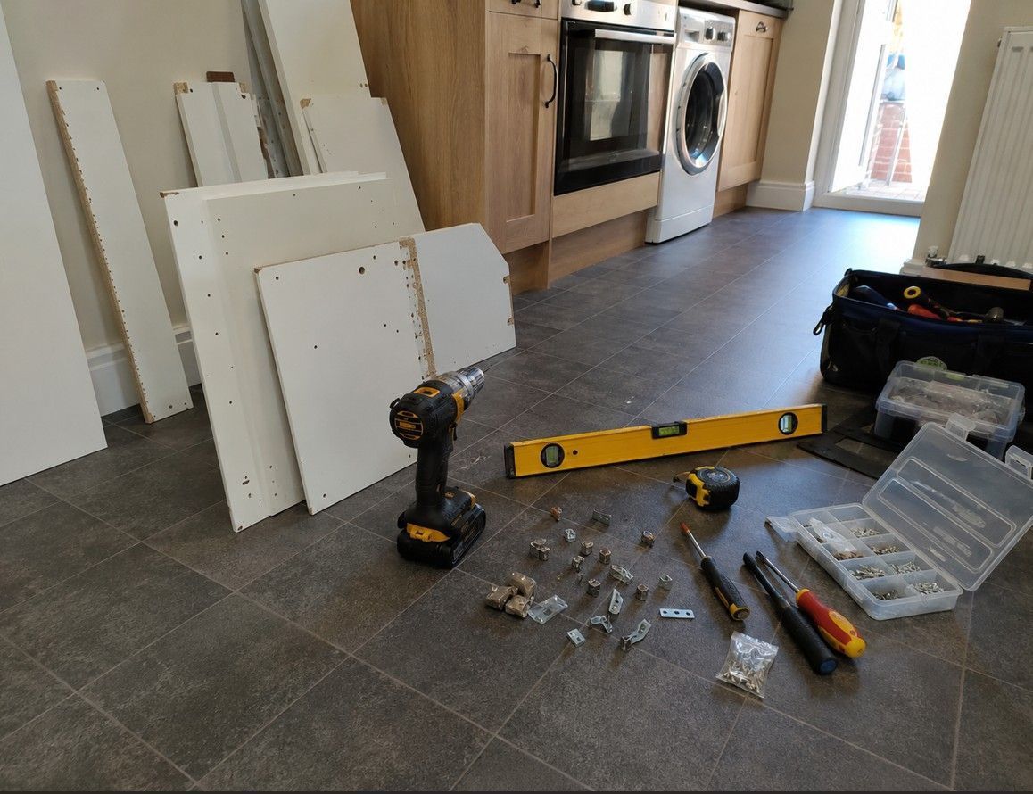 J&Z Property Maintenance handyman carrying out cupboard construction inside a home in Barry