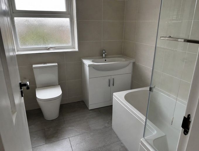 J & Z Property Maintenance tiling a property in Newport