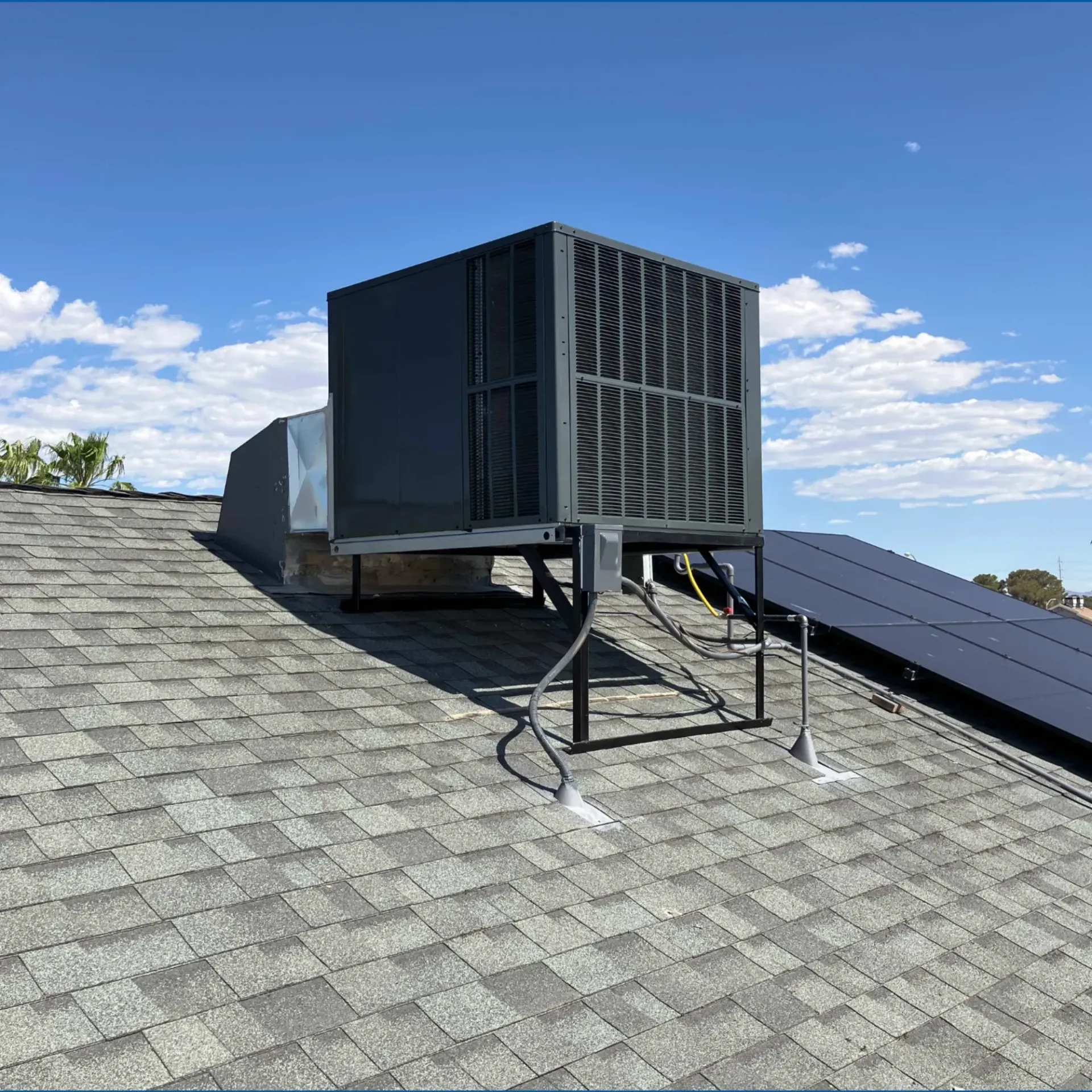 Doctor Cool - A roof with a fan and solar panels on it