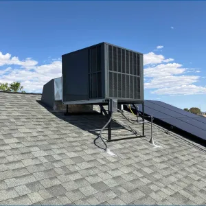 Doctor Cool - A roof with a fan and solar panels on it