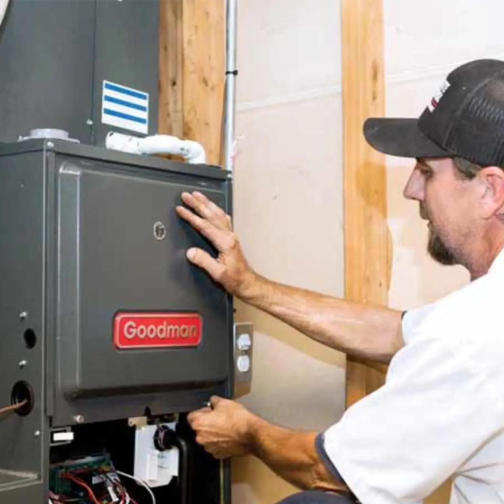 Doctor Cool - A man in a hat is working on a heating system.