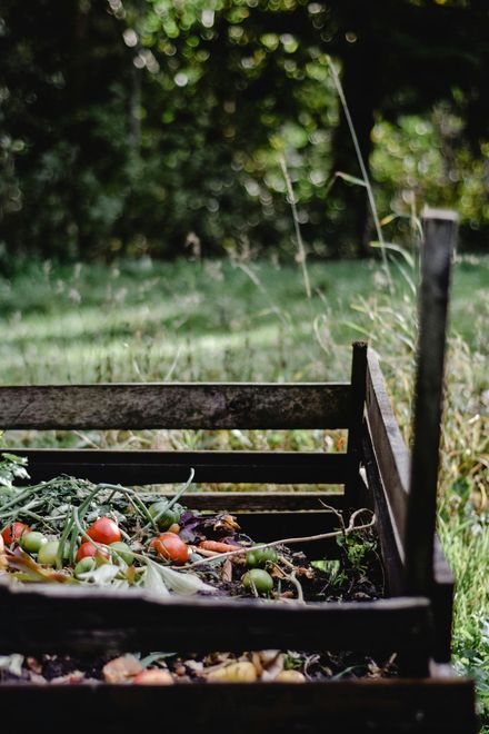 Garden waste and wooden branches in small metal trailer