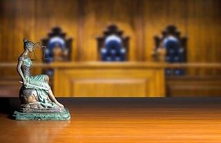 Lady Justice In Courtroom — Real Estate Attorneys in Longmont, CO