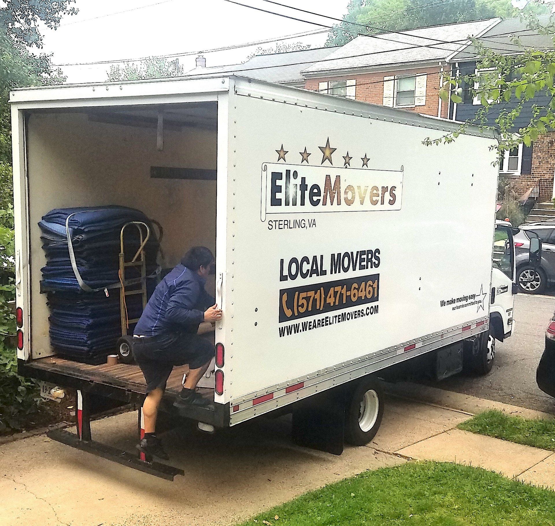 Elite movers opening the buck of the truck