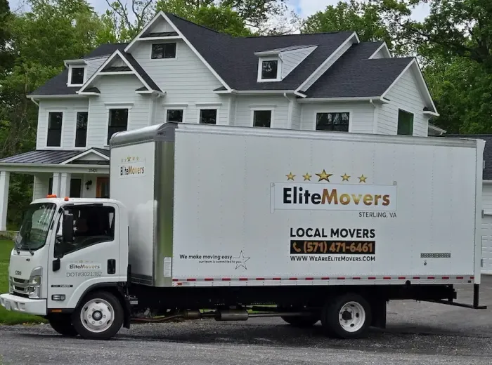a white item is parked in the driveway