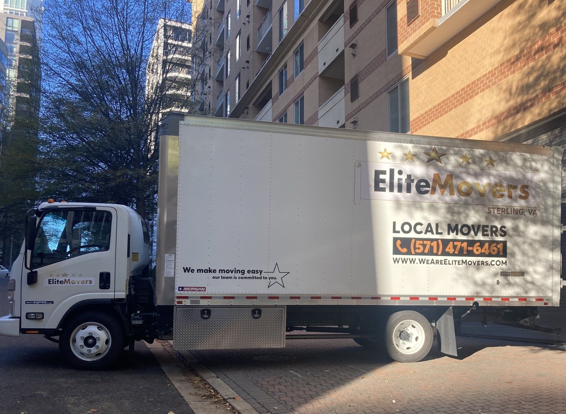 our Elite movers truck is parked in loading dock 