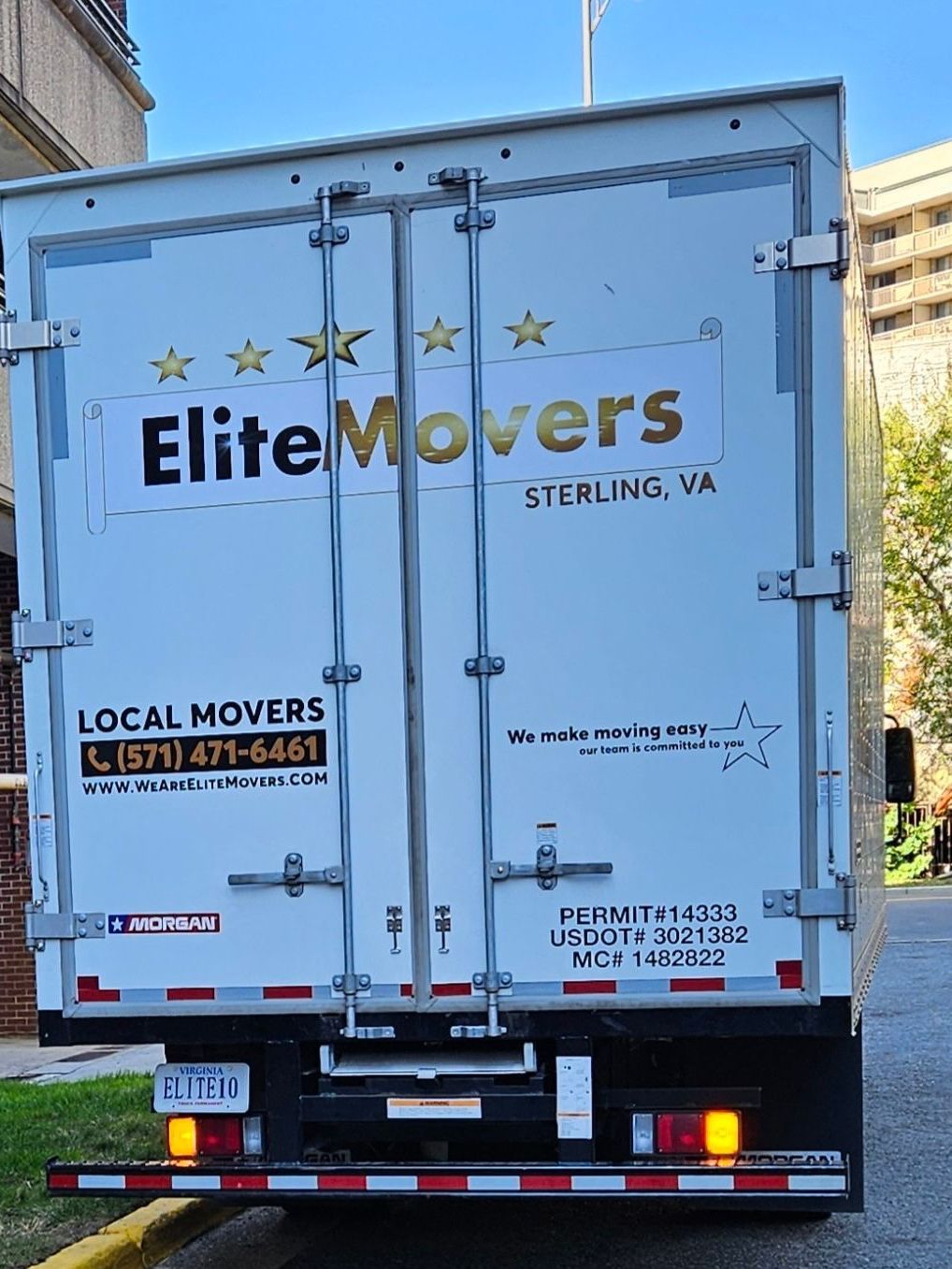 moving truck is parked in the street