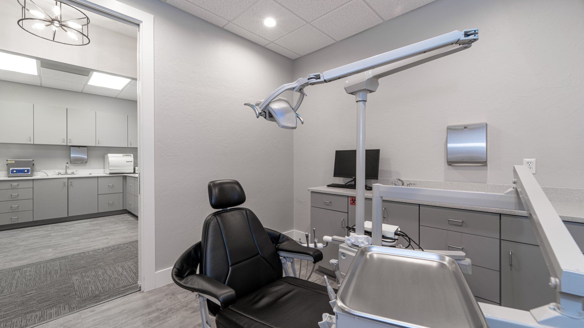 A dental office with a dental chair and dental equipment.