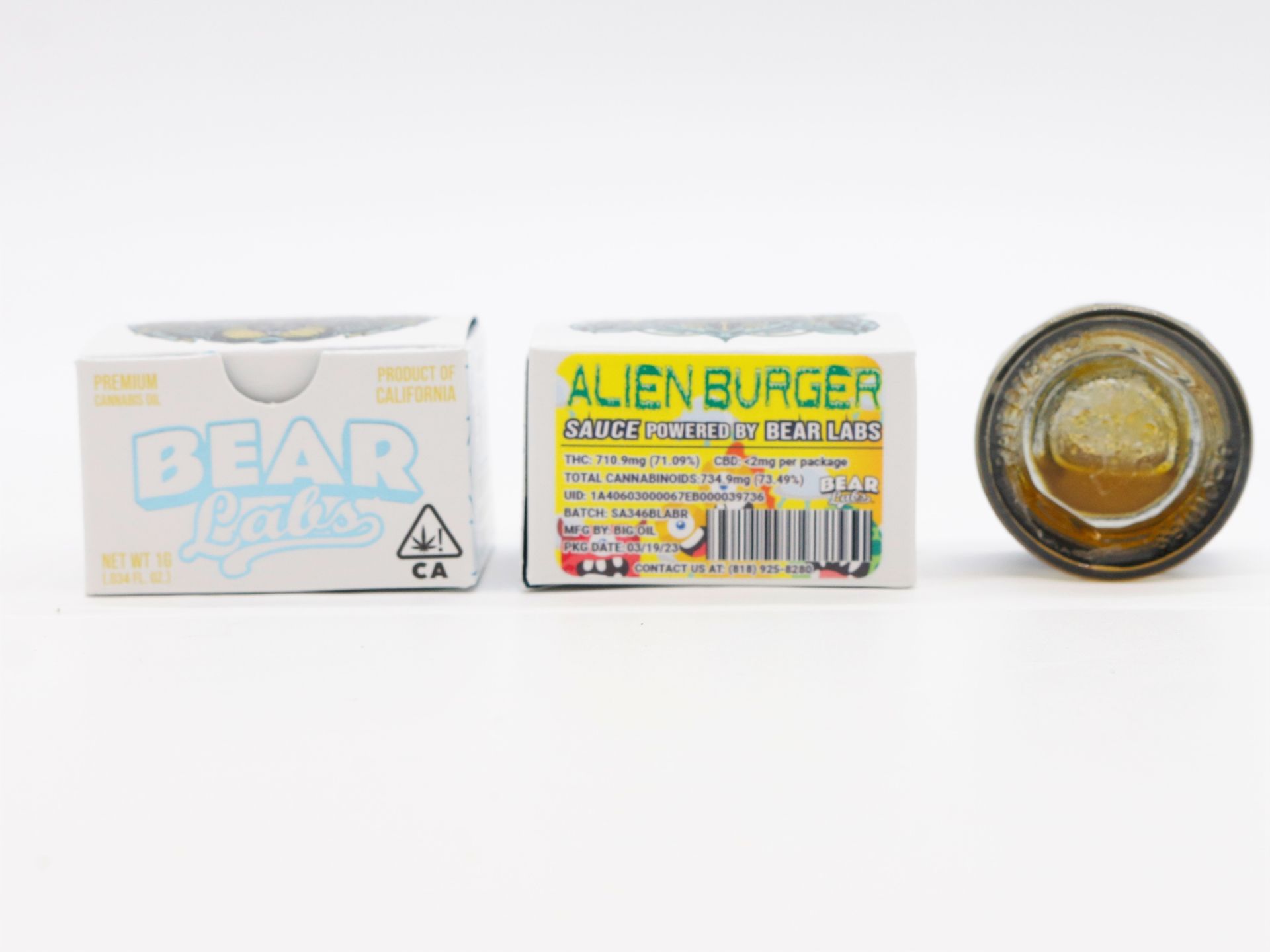 A box of alien burger next to a bottle of it