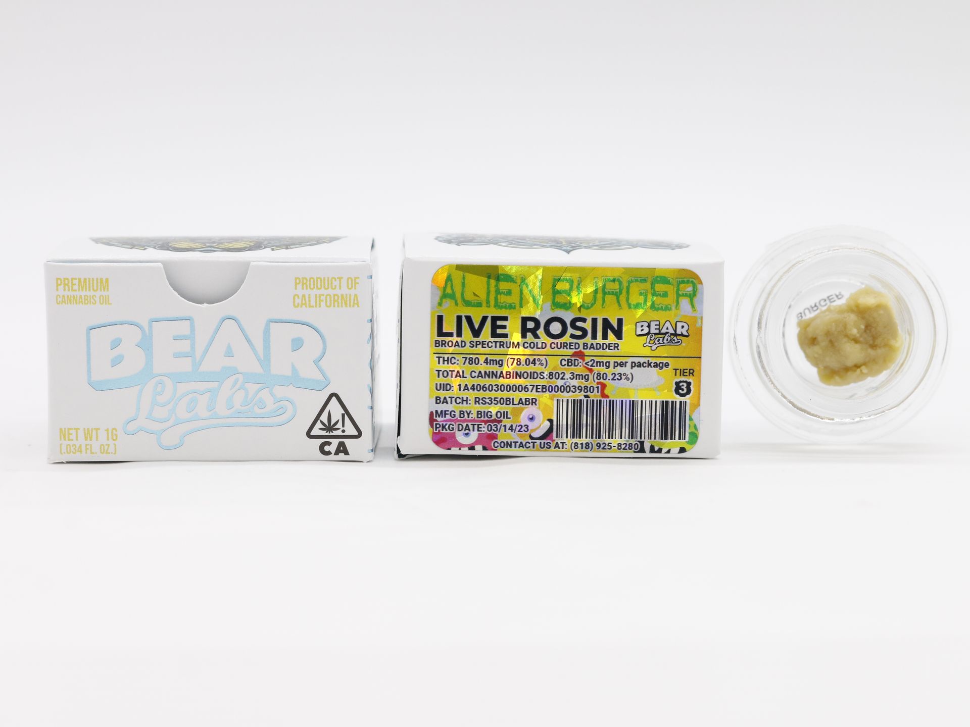 A box of bear comics alien burger live rosin and a container of live rosin.