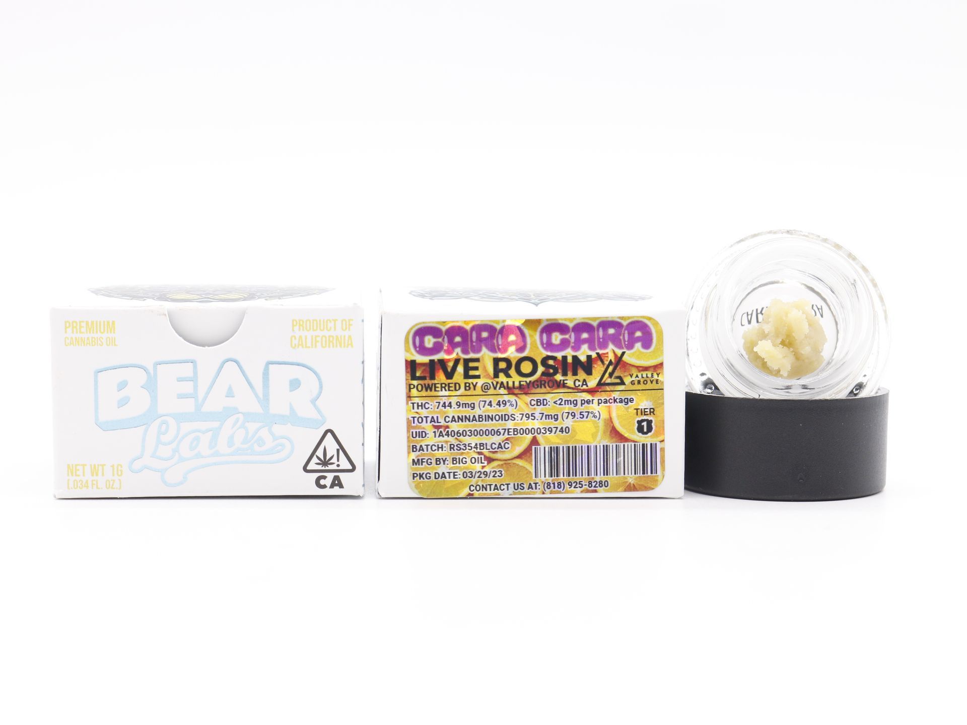 A box of card cobra live rosin next to a glass container.