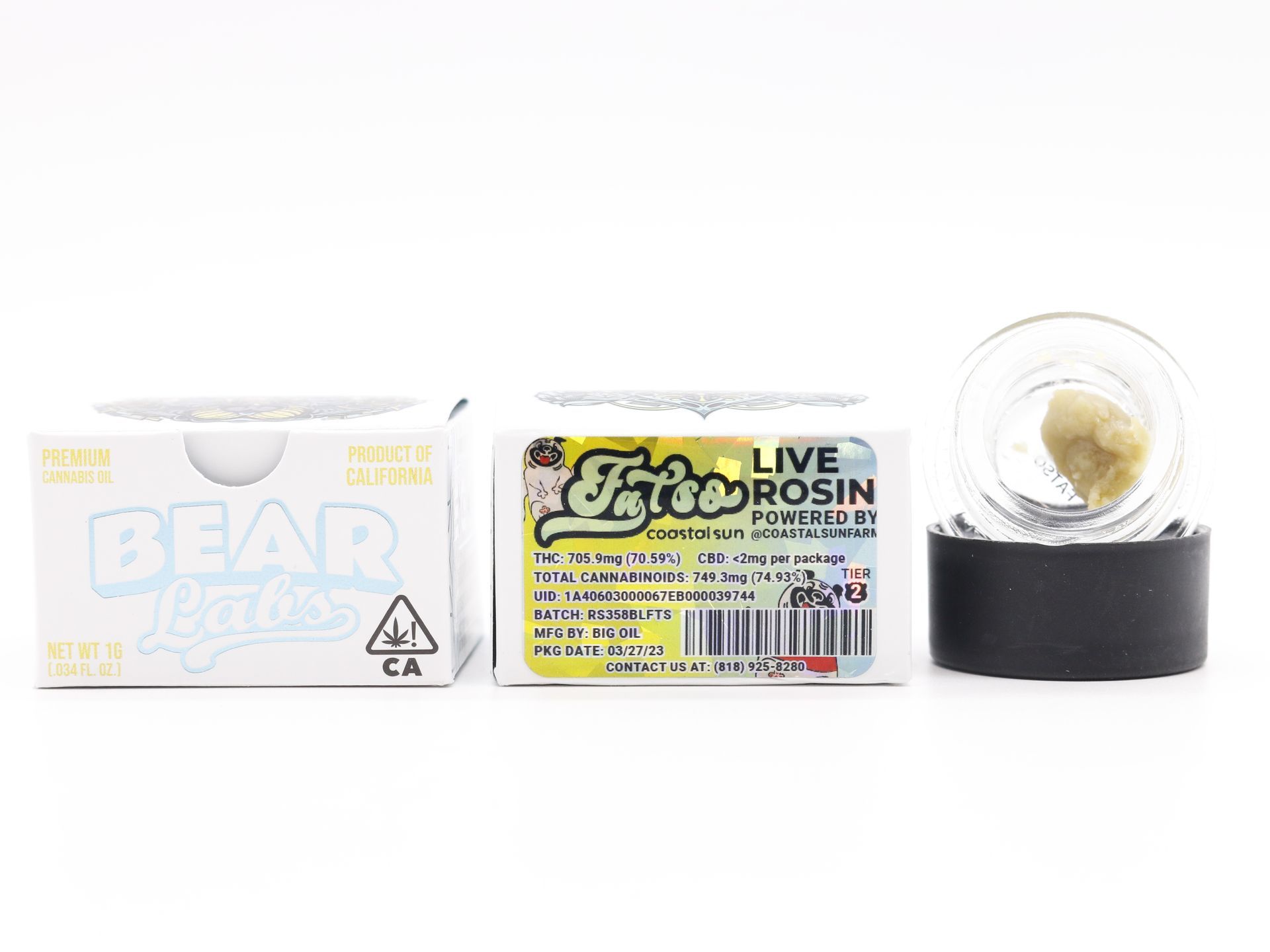A jar of live rosin next to a box of live rosin.