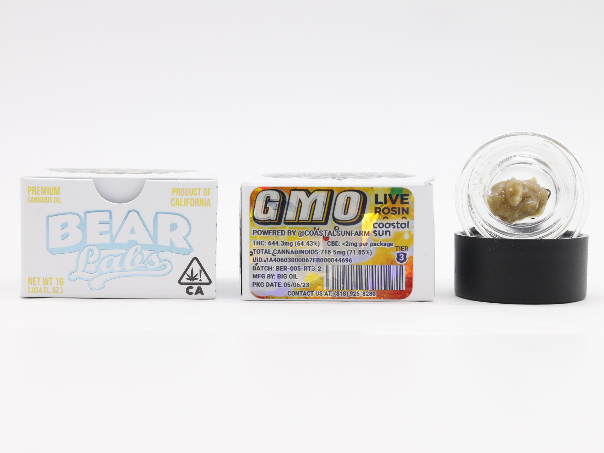 A box of gmo live rosin next to a jar of gmo live rosin.