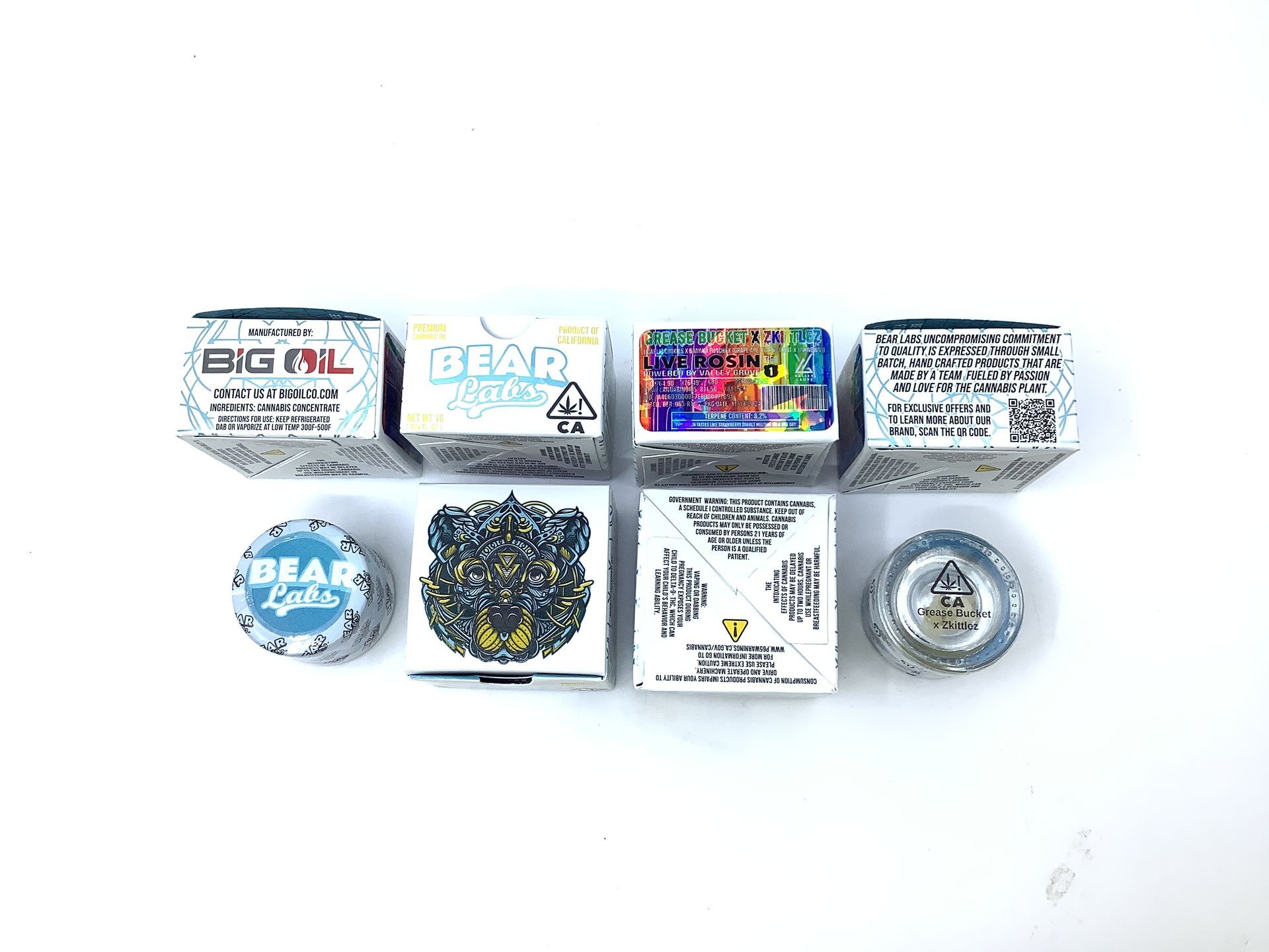 A box of bear labs next to a jar of Grease Bucket X Zkittlez