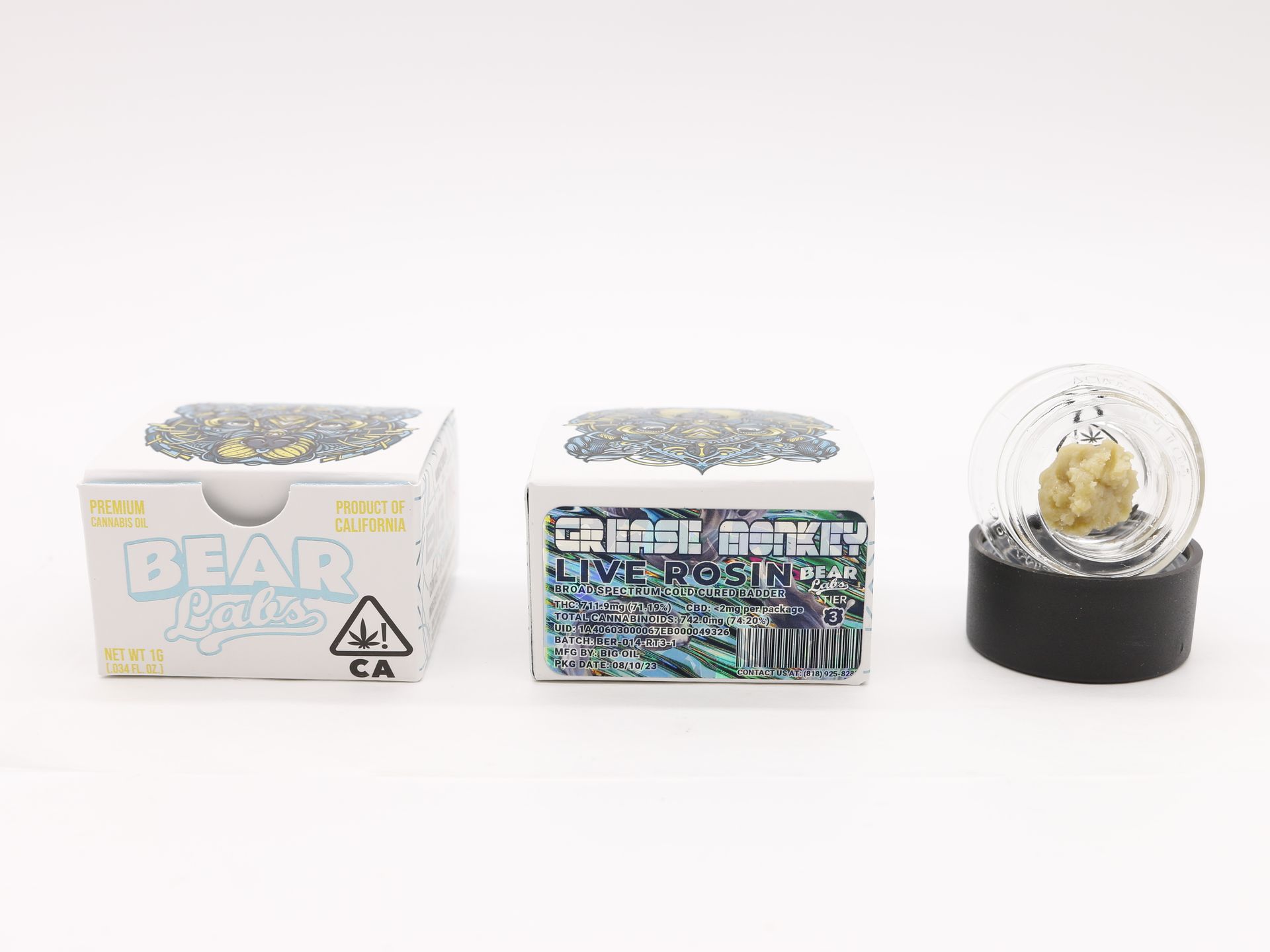 A box of bear labs next to a jar of Grease Monkey