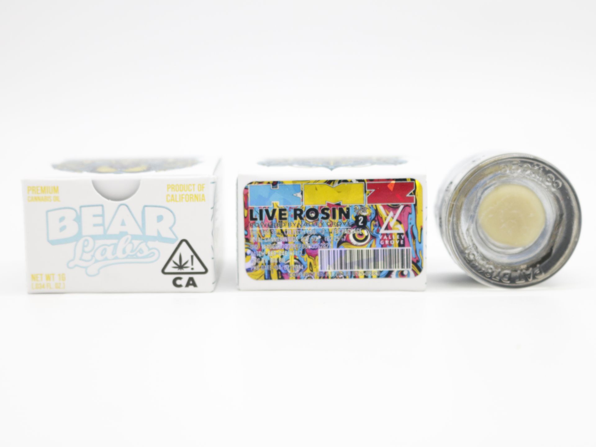 A box of bear labs next to a jar of KMZ
