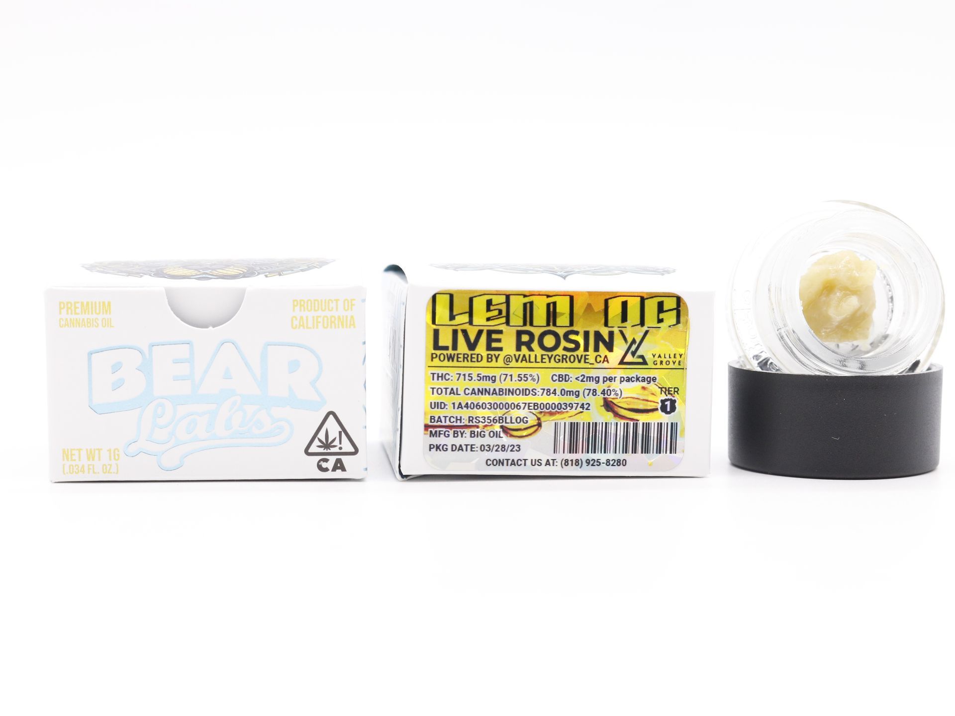 A box of live rosin next to a jar of rosin.