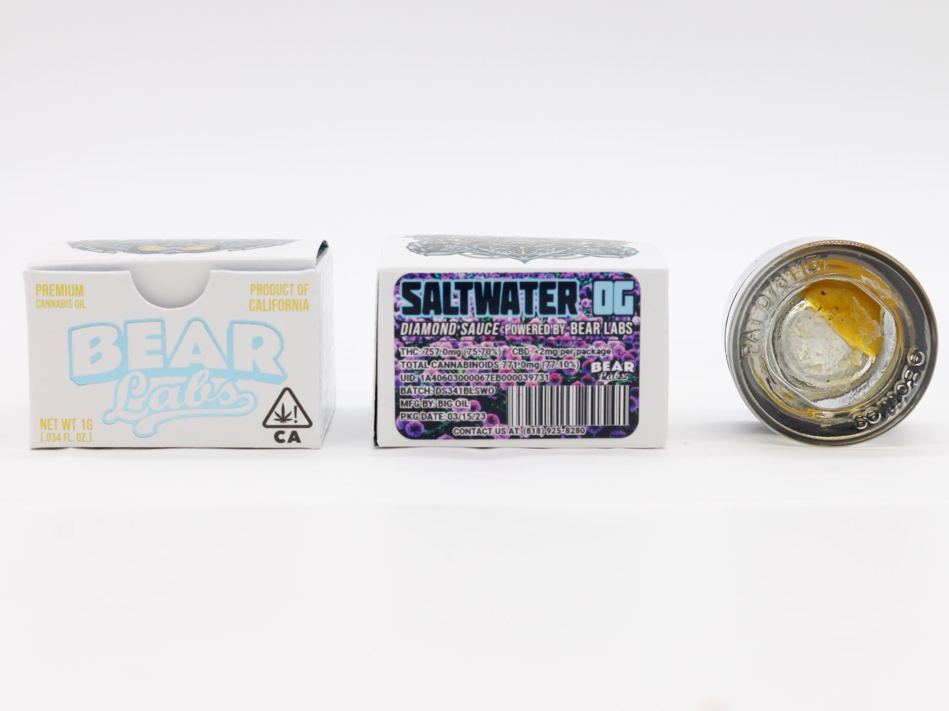 A box of bear wax and a jar of saltwater og are sitting next to each other on a table.