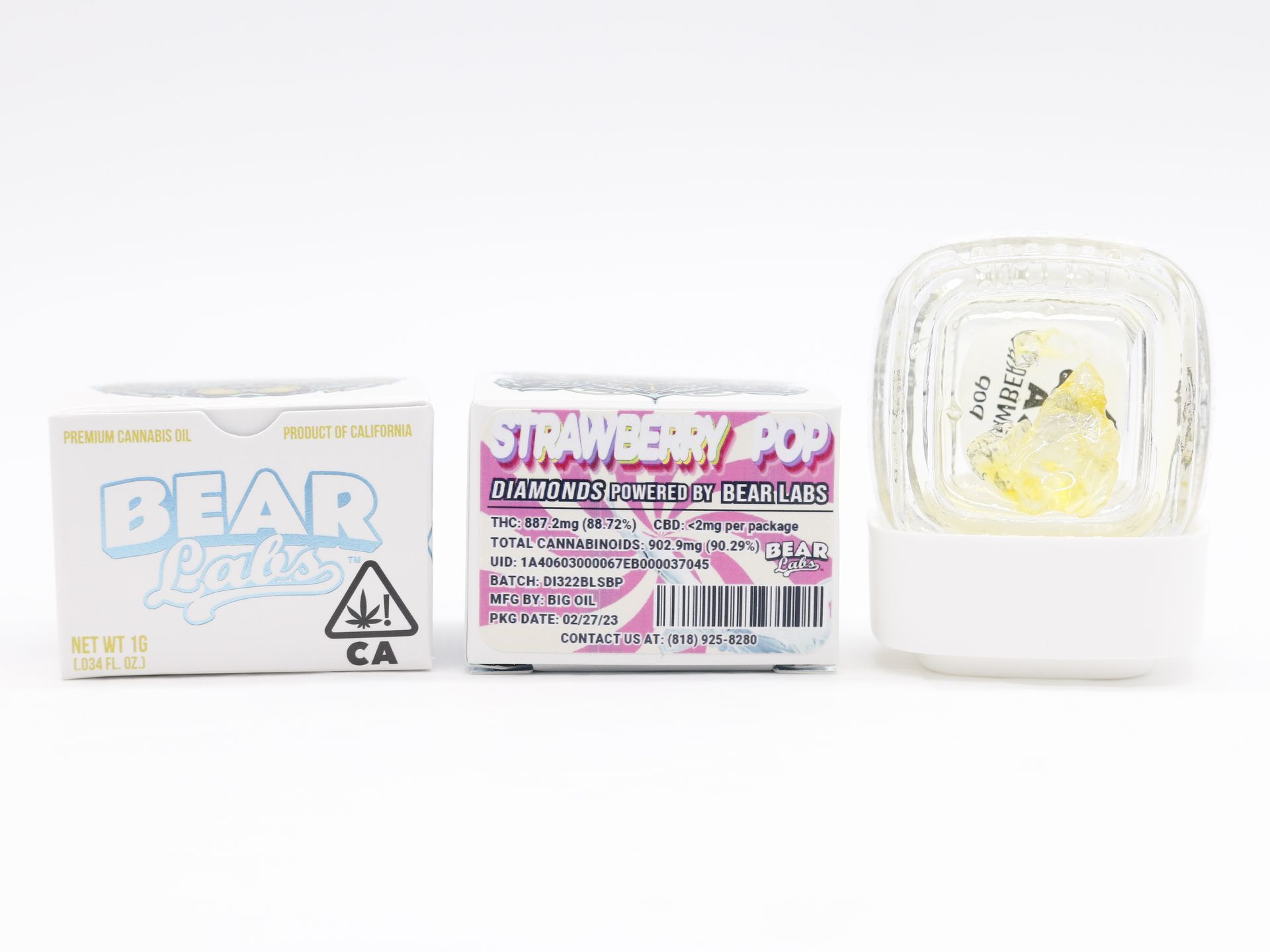 A box of bear butter next to a jar of bear butter on a white surface.