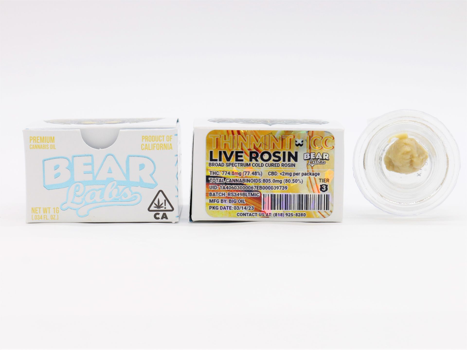 A box of live rosin next to a jar of rosin.