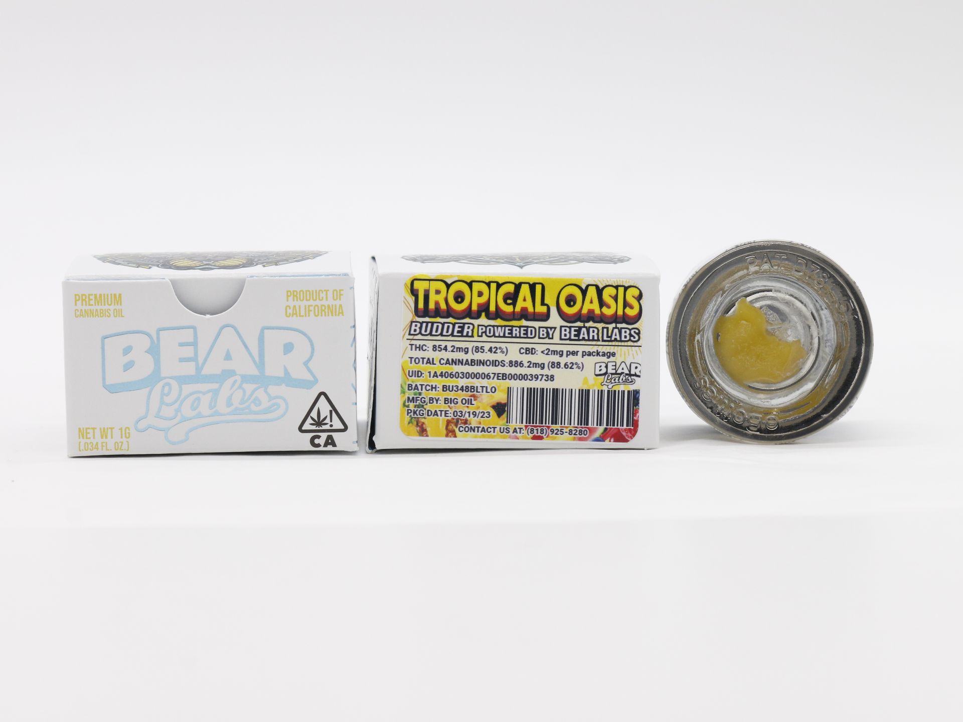 A box of bear talks tropical oasis next to a jar of bear talks tropical oasis.