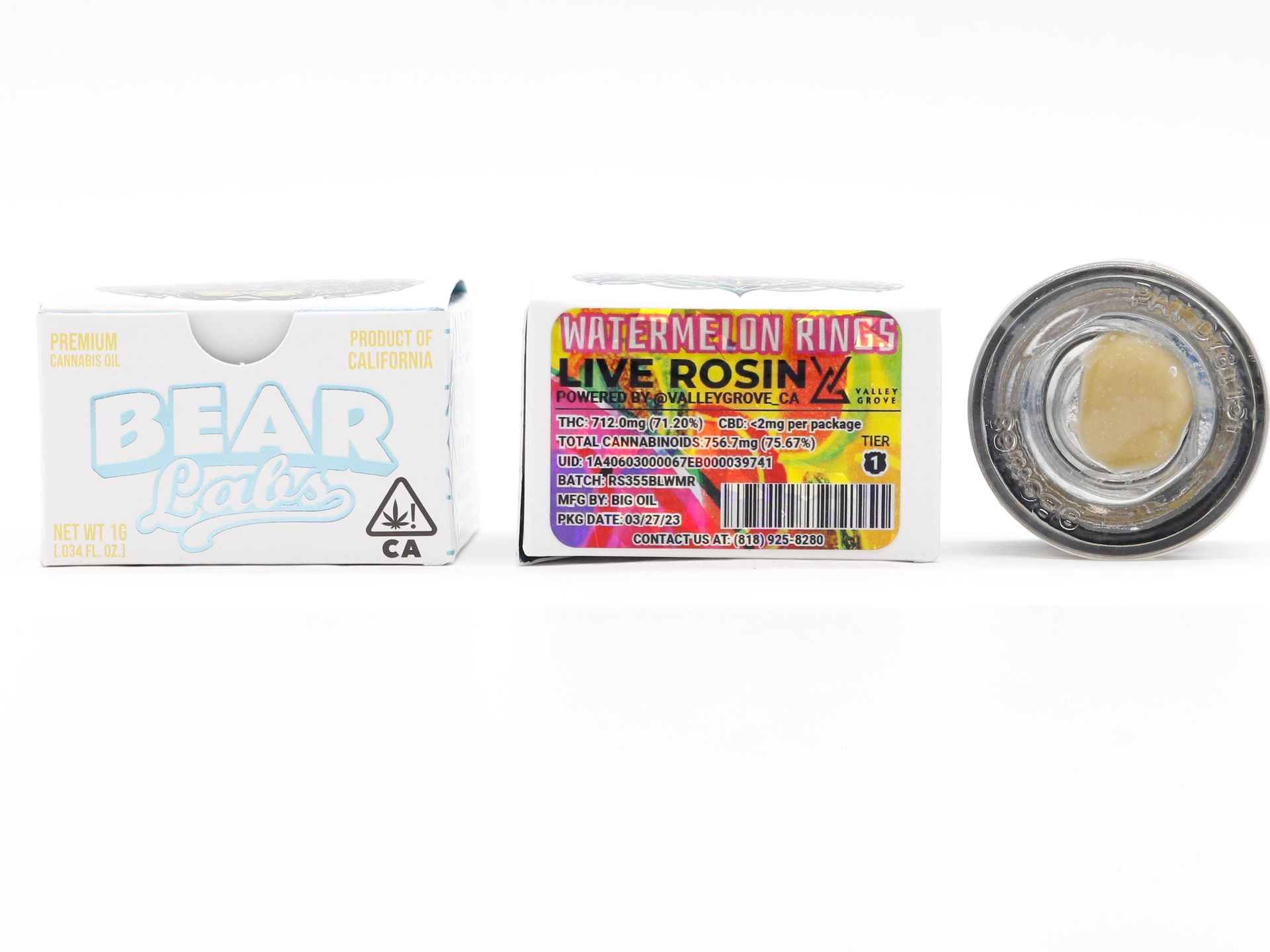 A box of watermelon rings live rosin next to a jar of rosin.