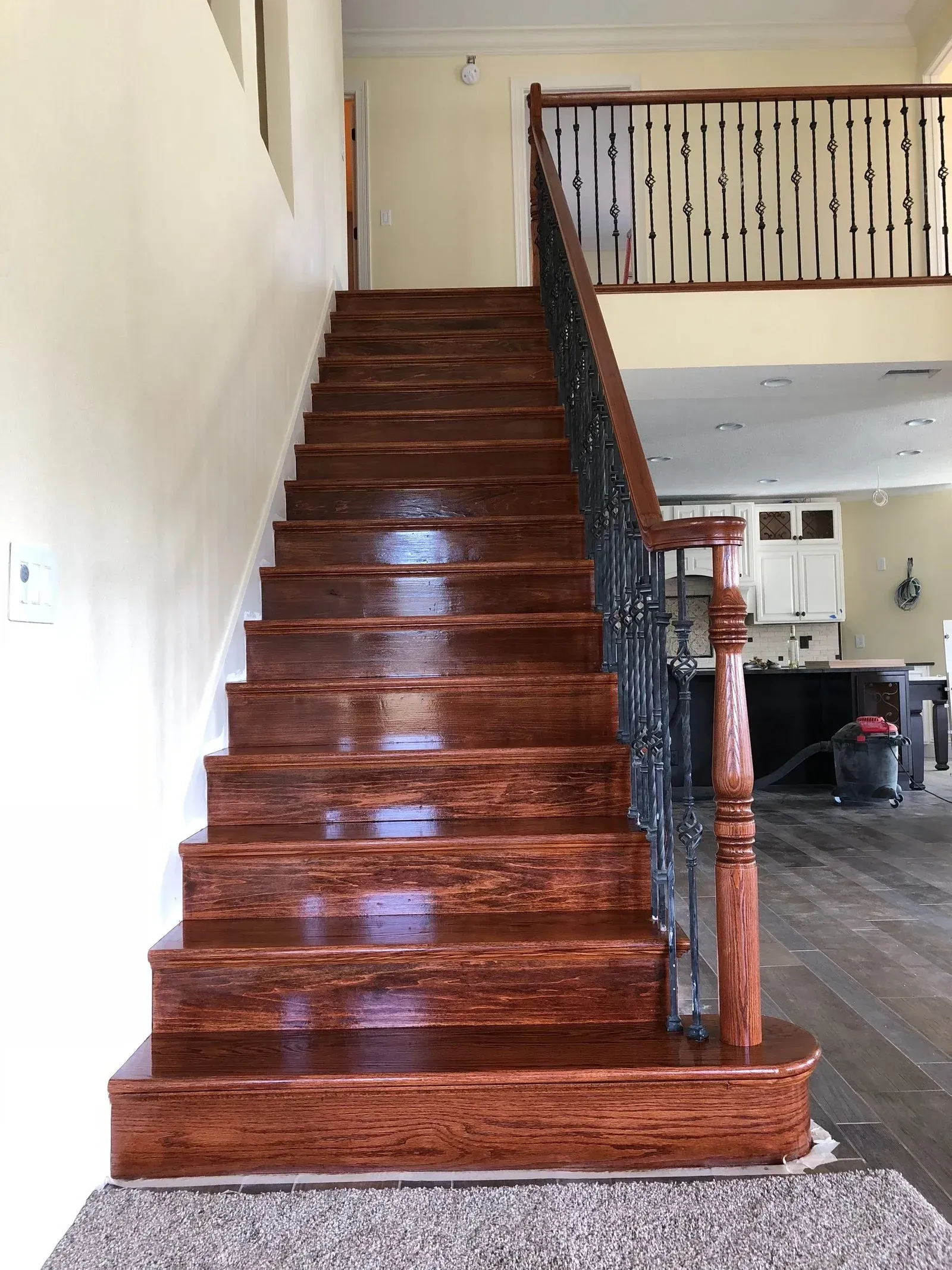 A wooden staircase leading up to a second floor in a house.