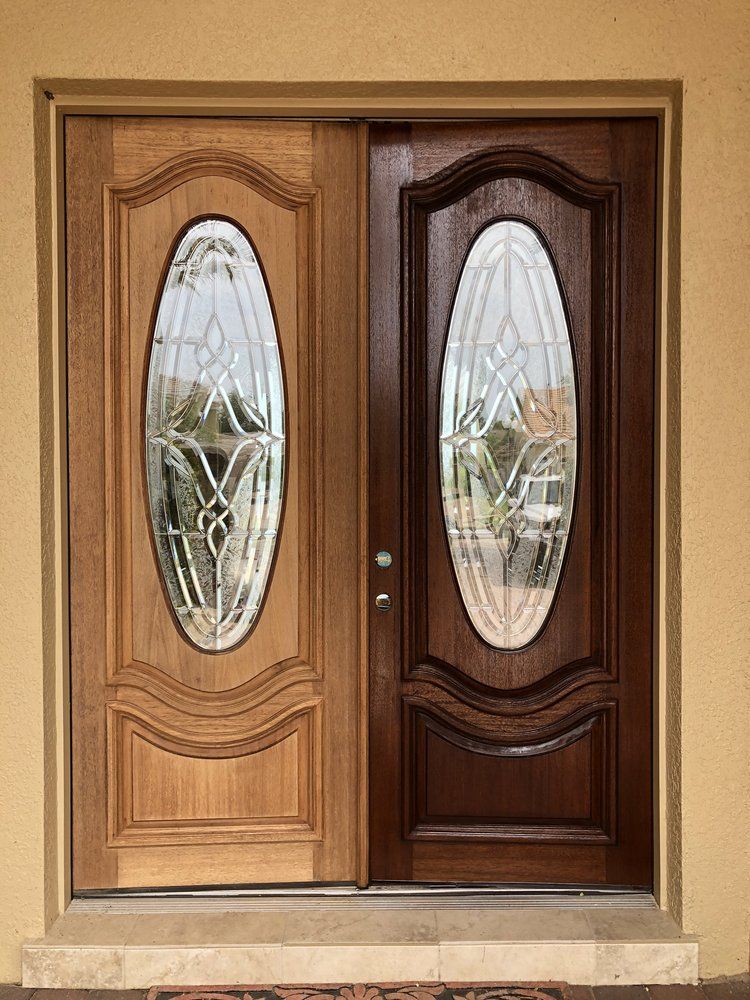 A before and after picture of a wooden door with stained glass.