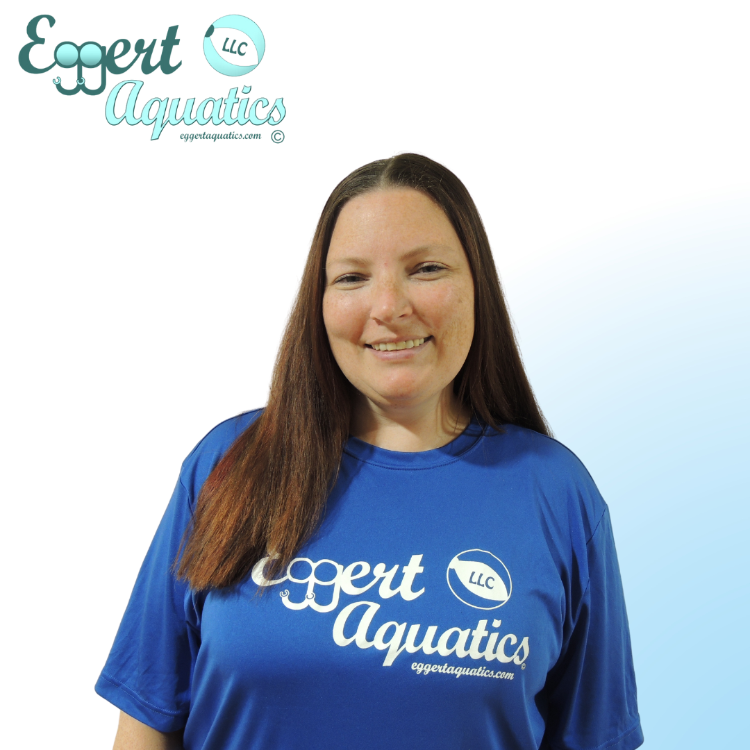 A woman wearing a blue shirt that says expert aquatics