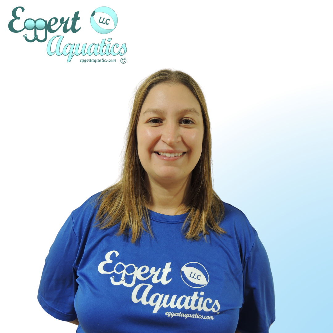 A woman wearing a blue shirt that says expert aquatics