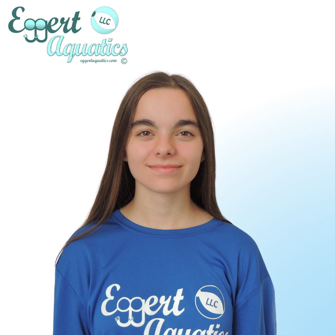 A woman wearing a blue shirt that says expert aquatics