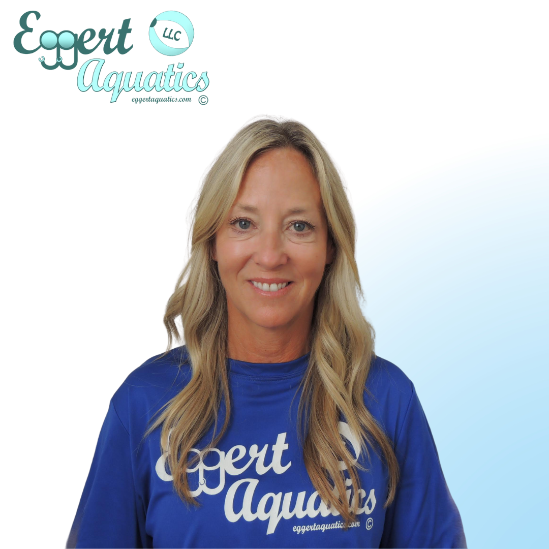 A woman wearing a blue shirt that says expert aquatics