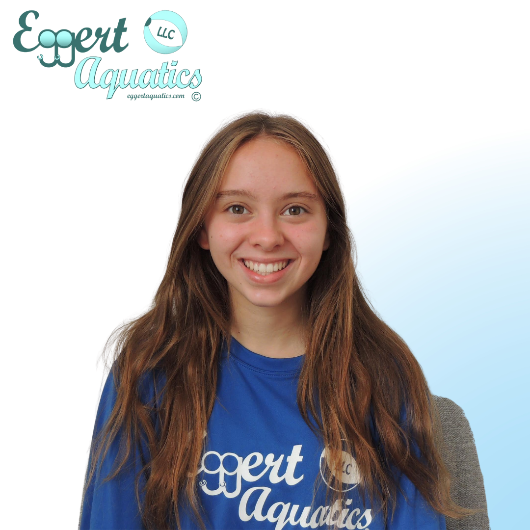 A girl wearing a blue shirt that says expert aquatics