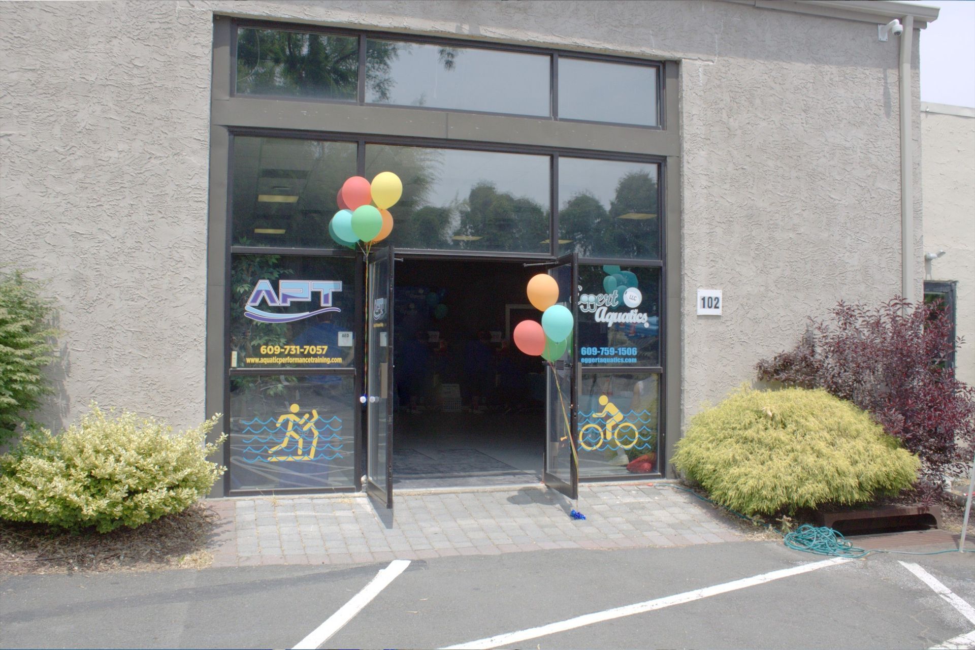 The front of a building with balloons in front of it