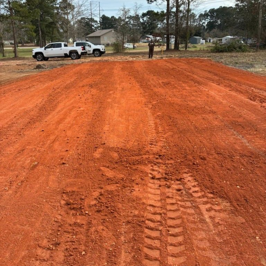 Person inspecting an open sewer manhole in an outdoor setting. Person inspecting an open sewer manhole in an outdoor setting.