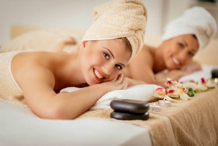 Cute young woman enjoying during a skin care treatment at a spa