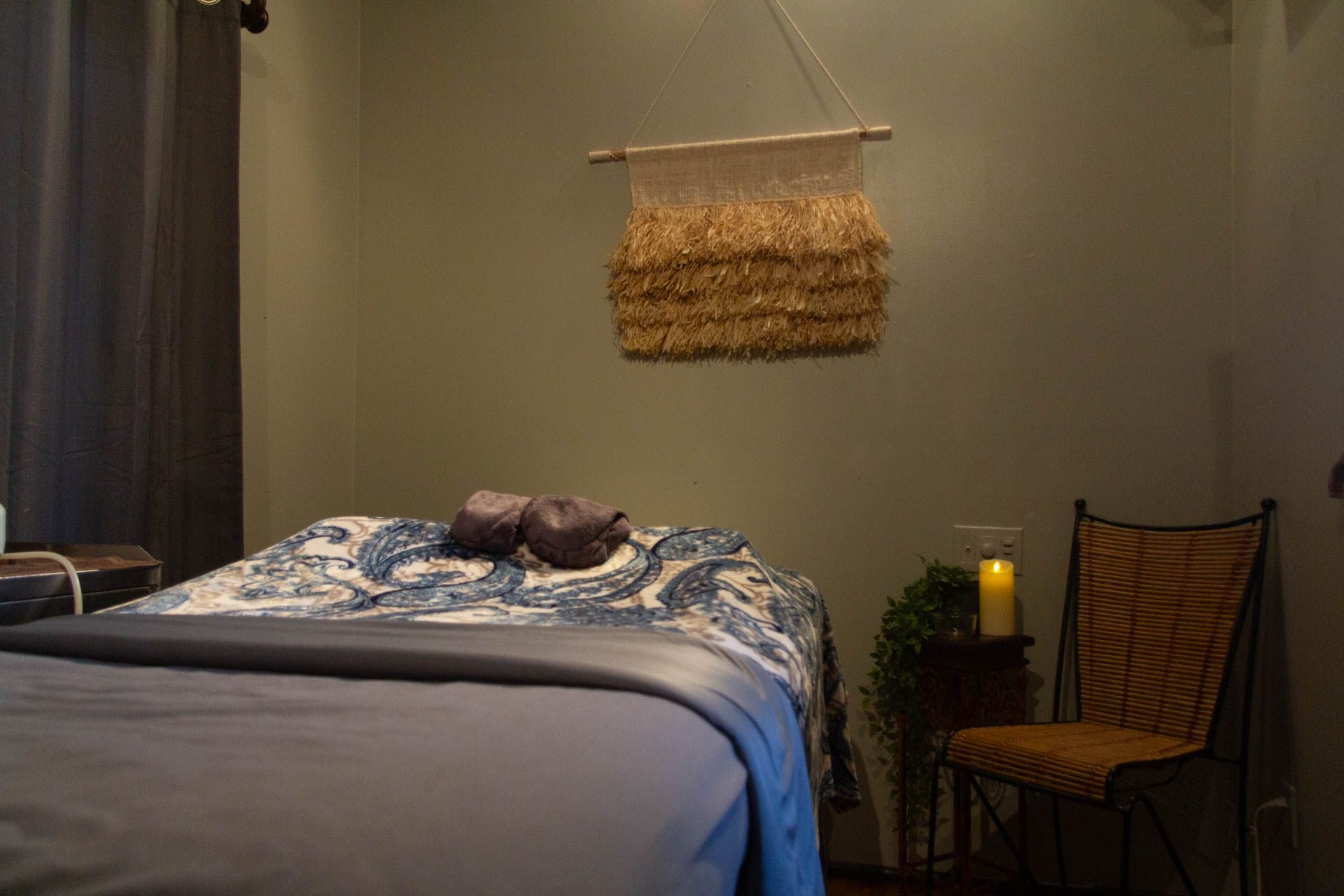 there is a bed and a chair in the room .