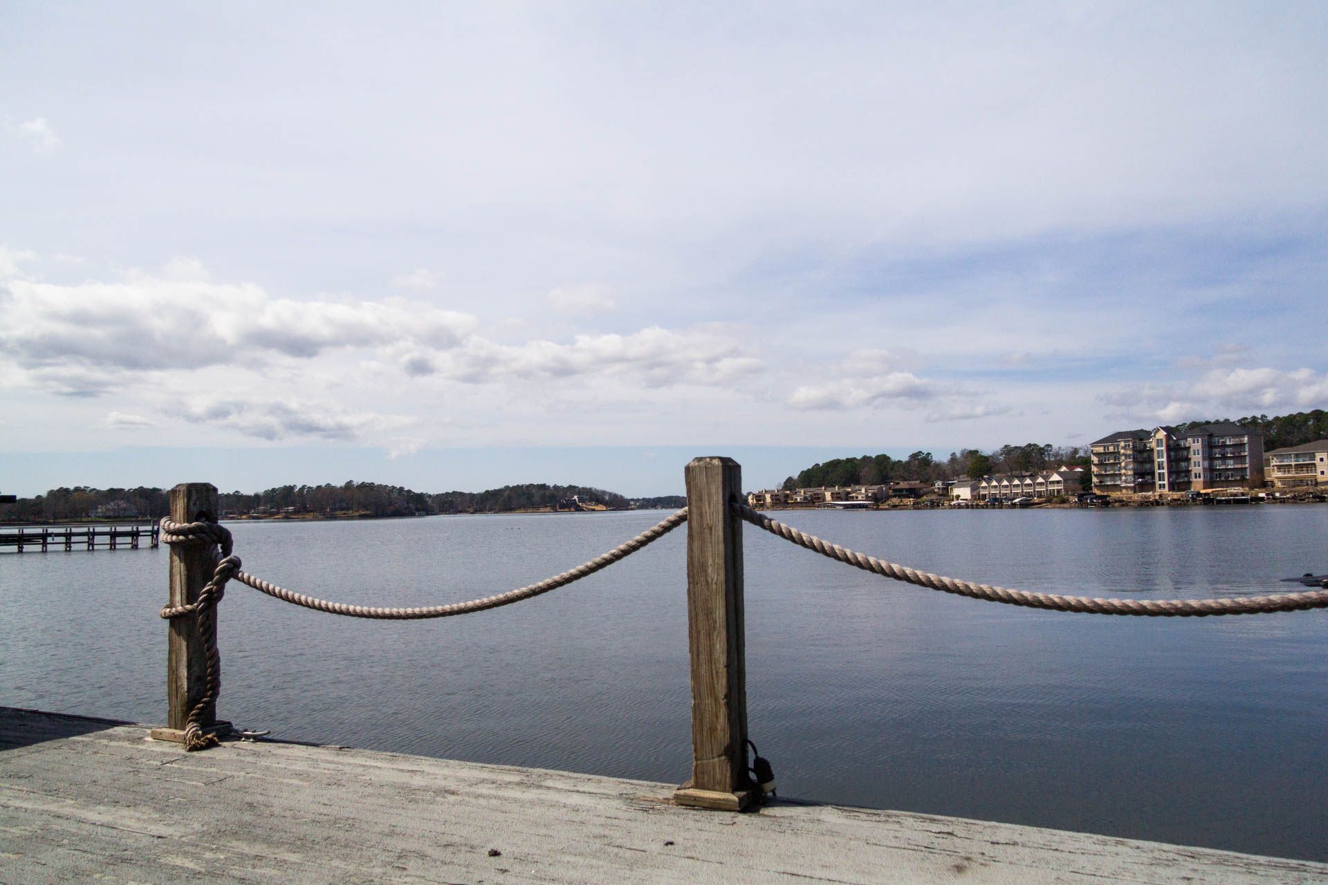 a rope fence surrounds a body of water
