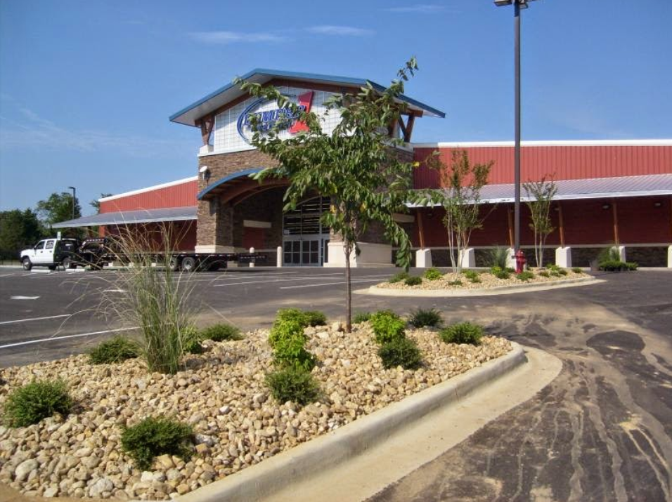 A large building with a parking lot in front of it