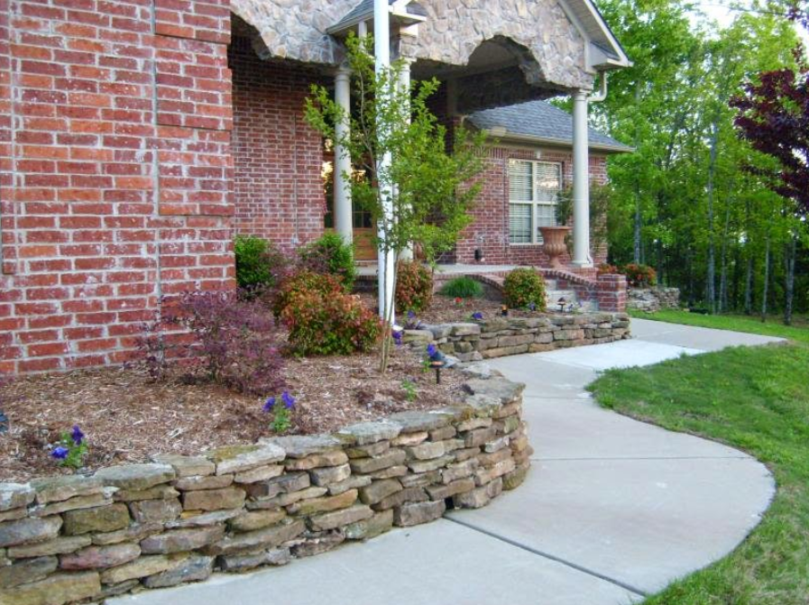 A brick house with a stone walkway leading to it